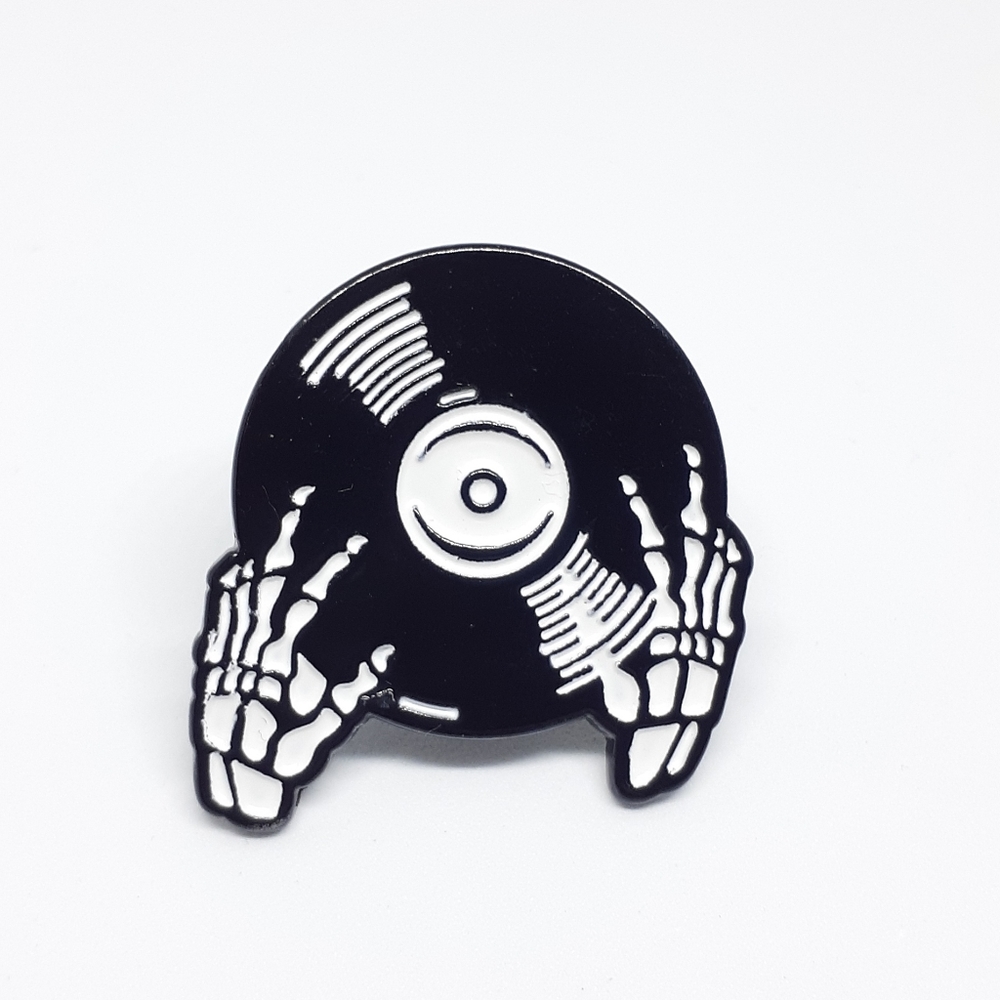 Skeleton hands vinyl record enamel pin